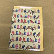 Colourful birds on yellow card