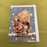 Greeting card with a squirrel design on a textured green background